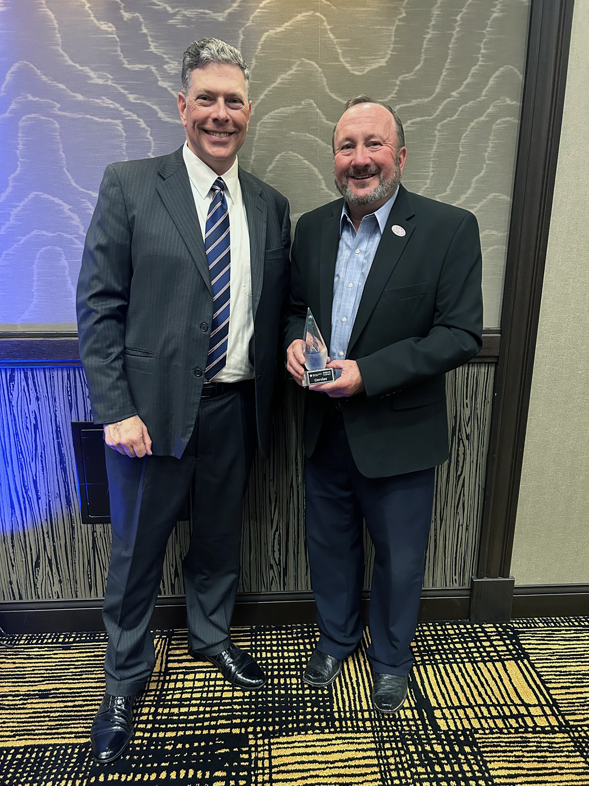 Bluepeak’s Randy Beutler (right) and Richard Emery hold the fiber internet provider’s Rising Star Award at Lawton Fort Sill’s 2023 Annual Banquet on Friday, June 9, 2023.