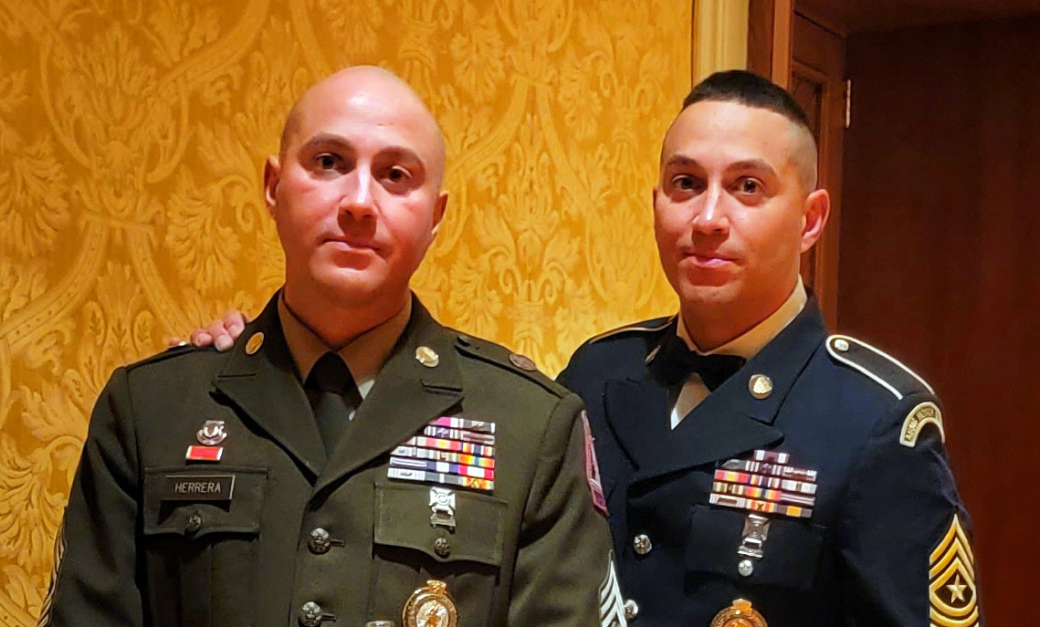 Sgt. Maj. Edwardo Herrera (right) pictured with his twin brother, Command Sgt. Maj. Edmundo Herrera, at the 2023 Senior Enlisted Leader Induction Ceremony in Cheyenne, Wyoming.